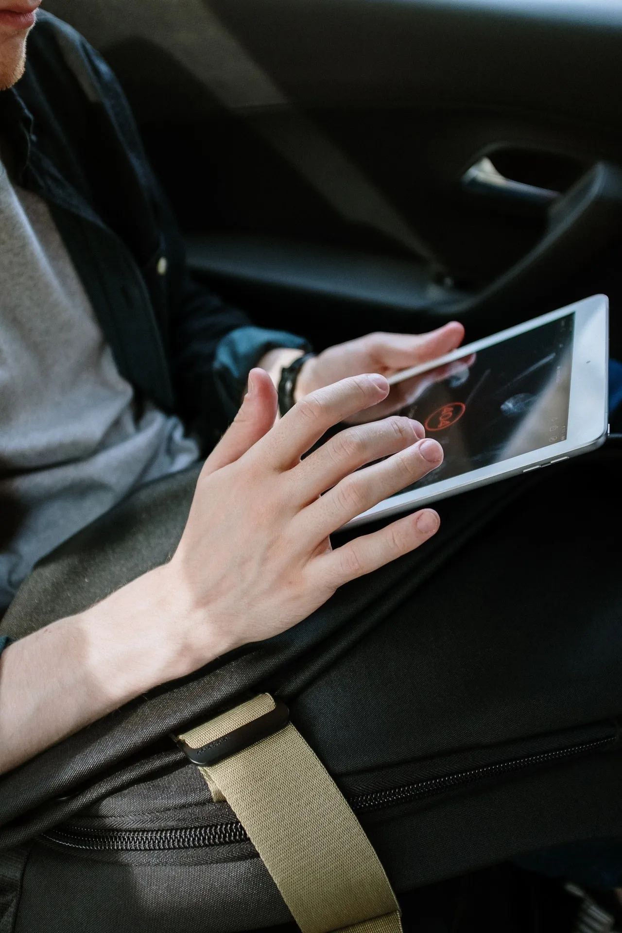 Taxi Passenger using a tablet